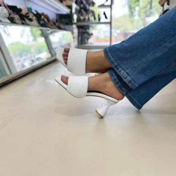 Step into effortless style with the Urbantoes Luxe Block Heel Sliders, designed for women who value comfort, durability, and fashion-forward design. Featuring a sleek open-toe silhouette and a sturdy block heel, these sliders provide the perfect balance of height and stability for all-day wear. The cushioned insole ensures maximum comfort, making them ideal for office wear, casual outings, festive occasions, or evening gatherings. Lightweight yet long-lasting, the Luxe Block Heel Sliders can be paired with ethnic wear, dresses, skirts, or trousers to add a chic finishing touch to any outfit. Whether you’re dressing up for a special occasion or elevating your everyday look, these sliders combine modern elegance with practical comfort, making them a versatile must-have in every woman’s footwear collection.