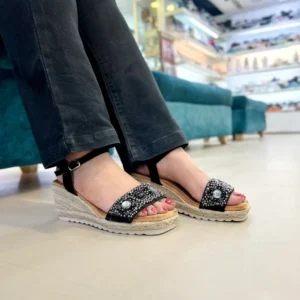 Add a touch of sparkle to your step with the Urbantoes Glimmer Black Studded Wedge Sandals. Designed for women who love style, comfort, and durability, these wedges feature eye-catching stud embellishments that elevate any outfit instantly. The cushioned insole ensures all-day comfort, while the sturdy wedge heel offers stability for effortless wear. Lightweight yet durable, these sandals are perfect for office wear, casual outings, parties, or festive occasions. The classic black color makes them versatile and easy to pair with ethnic, western, or Indo-western attire. Whether you’re dressing up for a special occasion or adding a chic touch to everyday wear, the Glimmer Black Studded Wedges combine elegance, comfort, and practicality for modern women who want their footwear to make a statement.