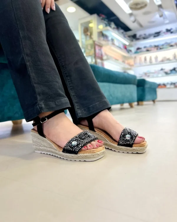 Add a touch of sparkle to your step with the Urbantoes Glimmer Black Studded Wedge Sandals. Designed for women who love style, comfort, and durability, these wedges feature eye-catching stud embellishments that elevate any outfit instantly. The cushioned insole ensures all-day comfort, while the sturdy wedge heel offers stability for effortless wear. Lightweight yet durable, these sandals are perfect for office wear, casual outings, parties, or festive occasions. The classic black color makes them versatile and easy to pair with ethnic, western, or Indo-western attire. Whether you’re dressing up for a special occasion or adding a chic touch to everyday wear, the Glimmer Black Studded Wedges combine elegance, comfort, and practicality for modern women who want their footwear to make a statement.